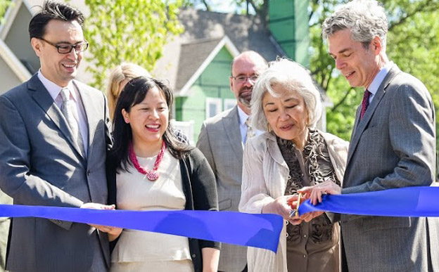 Tomoko Masur and Mayor Tom Roach cut the ribbon